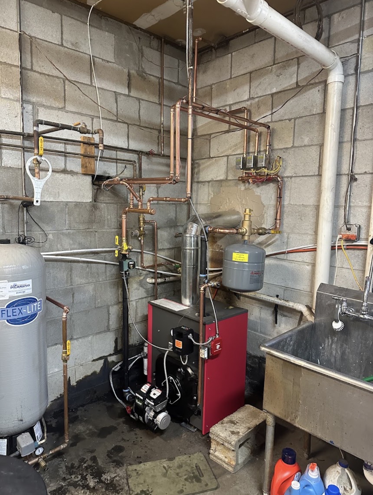 Complex copper piping around a boiler system